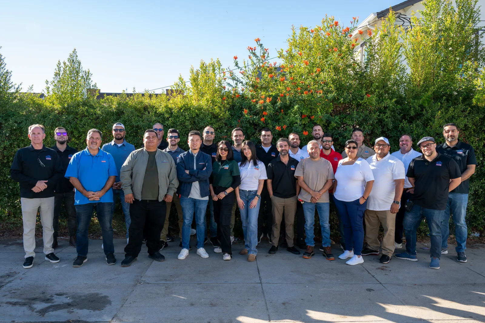 The full ADU Resource Center team gathered outdoors